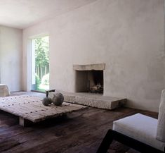 a living room filled with furniture and a fire place