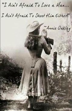 a woman in a dress and hat holding a magnifying glass with the words i am