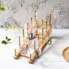 a wooden stand with several glasses on it