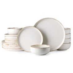 the white dishes are stacked on top of each other