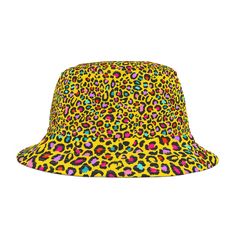 Unleash your wild side with our eye-catching yellow bucket hat, adorned with striking black and multi-colored leopard spots. This hat combines a sunny, cheerful background with a playful and fierce leopard print, perfect for adding a touch of fun and flair to your summer wardrobe. The bold pattern is sure to make a statement wherever you go, whether you're hitting the beach or strolling through the city. Features: Material: High-quality, durable fabric that is lightweight and comfortable for all-day wear. Design: Bright yellow base with a dynamic mix of black and multi-colored leopard spots, creating a bold and trendy look. Style: Ideal for sunny days, casual outings, or adding a pop of personality to your everyday outfits. Perfect For: Summer Adventures: A standout accessory for beach tri Trendy Yellow Festival Hat, Fun Yellow Sun Hat With Curved Brim, Yellow Retro Bucket Hat With Curved Brim, Trendy Yellow Bucket Hat, Trendy Festival Bucket Hat With Flat Brim, Retro Yellow Bucket Hat With Curved Brim, Fun Yellow Hat For Festivals, Trendy Bucket Hat With Flat Brim For Festivals, Fun Yellow Festival Hat