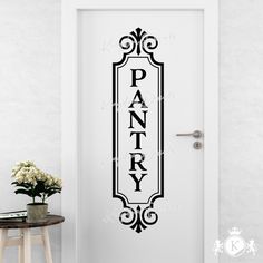 an entry door with the word pantry on it and a vase in front of it