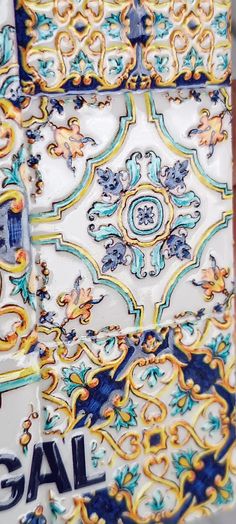 an ornate tile design with blue and yellow accents on the bottom part of each piece