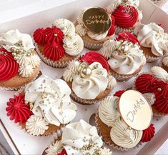 a box filled with lots of cupcakes covered in frosting