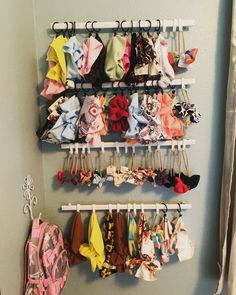 a bunch of clothes hanging on a rack