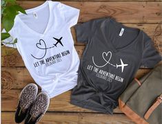 Personalized Let the Adventure Begin T-Shirts are the perfect to wear on your flight to the destination wedding of your dreams! Add any text you wish!! Surprise your guests that are traveling along! Children's sizes available upon request!  Click here if you do not want to add custom text: https://www.etsy.com/listing/707787494/let-the-adventure-begin-destination?ref=listings_manager_grid ♥ Processing Time ♥ All Items will require 1 to 3 business days to process. Business days are Monday through Friday not including holidays. Items will ship via US Postal Service. Orders placed within the United States take approximately 1 week to receive. If you need your order rushed shipping upgrades are available at checkout.  ♥ How Do I Order ♥  1. Select Size and color in the drop down menu on the ri Destination Wedding Travel Shirts, Traveling Tshirt Ideas, Couples Travel Shirts, Travel Matching Shirts, Travel Tshirt Design Ideas, Destination Wedding Shirts, Fun T-shirt For Summer Adventures And Vacation, Travel Tshirt, Wedding Shirt