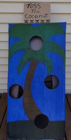 a cardboard box with a palm tree painted on it