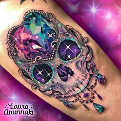 a colorful skull with jewels on it's leg