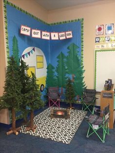 a classroom decorated with camping theme and trees