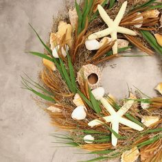 a wreath with seashells and starfish on it