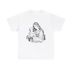 a white t - shirt with an image of the virgin mary holding a baby jesus