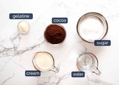 ingredients to make chocolate pudding on a marble counter top with the words gelatin, cocoa, sugar and water