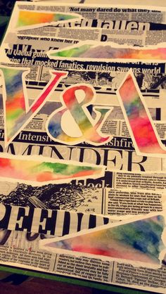 the newspaper is covered with colorful watercolors and paper advertises art and design