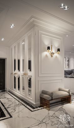 a room with marble flooring and white walls, lights on either side of the wall