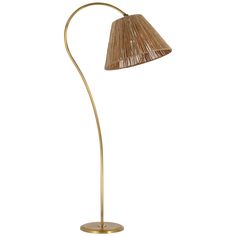 a gold floor lamp with a beige shade on it's side and a white background