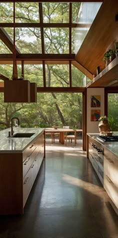 an open kitchen with wooden cabinets and windows