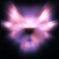 blurry image of an angel's wings in purple and pink colors with black background