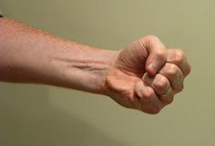 a man's arm with his fist extended