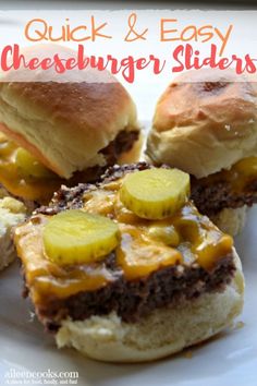 three hamburger sliders with cheese and pickles on them sitting on a white plate