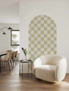 a living room filled with furniture and walls painted in shades of blue, beige and white