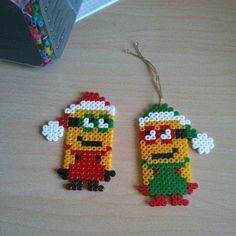 two christmas ornaments made out of legos