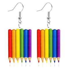 a pair of earrings with colored pencils hanging from them