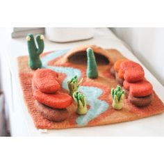 there is a desert scene made out of felt