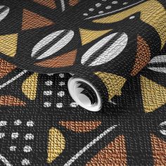 a close up view of a black and gold wallpaper with abstract designs on it