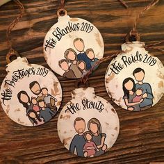 three personalized christmas ornament hanging on a wooden table