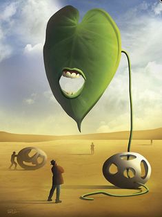 a man standing next to a giant green heart shaped object in the middle of a desert