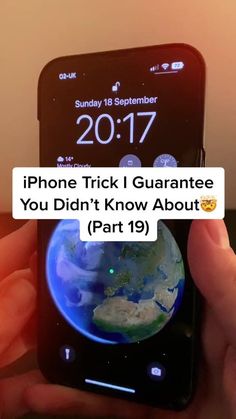 someone is texting on their cell phone with the earth in front of them that says, iphone trick i guarantee you didn't know about part 19