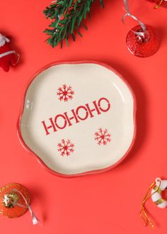 a plate with the word hoho on it surrounded by christmas decorations