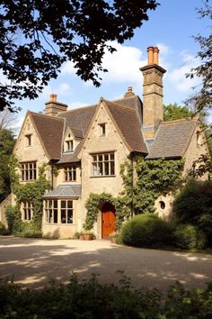 Rustic stone house with ivy and chimney stacks. Explore the quirky charm, secret staircases, and unintentional labyrinths of British country houses, where historical oddities meet modern mishaps in the most delightful way.