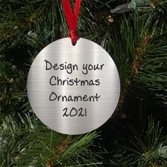 a personalized ornament hanging from a christmas tree