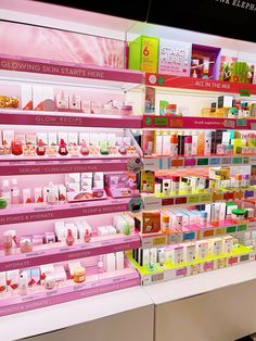 the shelves are filled with different types of cosmetics and beauty products for sale in a store