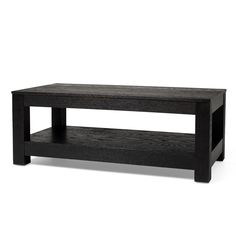 a black coffee table sitting on top of a white floor next to a wooden shelf