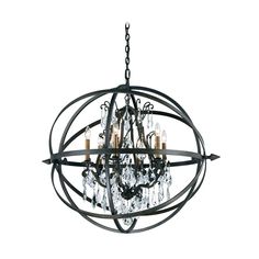 an orb chandelier with crystal drops hanging from the bottom, and metal frame around it