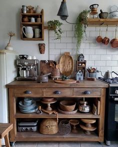 an old fashioned kitchen with pots and pans