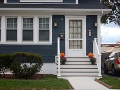 a house with blue siding and white trim