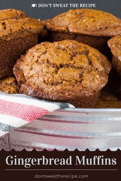 chocolate chip muffins are stacked on top of each other in a metal bowl