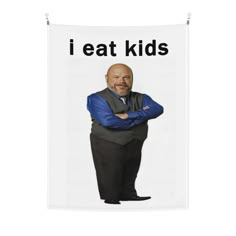 a man with his arms crossed standing in front of a sign that says i eat kids