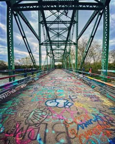 graffiti on the ground underneath a bridge