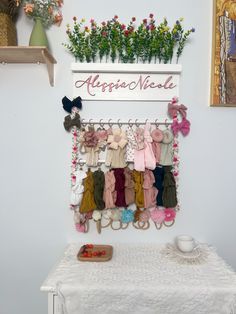 there is a wall hanging rack with clothes on it