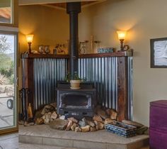 a living room with a fire place next to a sliding glass door that leads outside