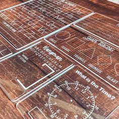 many different types of wood signs on a wooden table with numbers and times printed on them