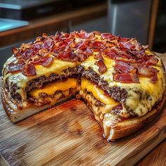 a cheese and bacon pizza cut in half on a cutting board