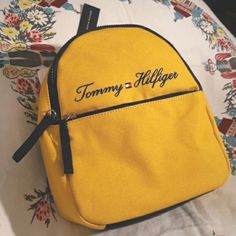 Tommy Hilfiger Yolk Yellow Mini Backpack Brand New With Tags Yolk Yellow Canvass With Navy Blue Accents Traditional Tommy Branding Size 9w X 11h X 4d Yellow Shoulder Bag For Back To School Travel, Yellow Shoulder Bag For Back To School, Back To School Yellow Shoulder Bag, Yellow School Bags For Back To School, Yellow Back To School Bag With Zipper Closure, Trendy Yellow Backpack Bag, Back To School Yellow Shoulder Bag With Adjustable Strap, Trendy Yellow School Backpack, Back To School Yellow Backpack With Zipper