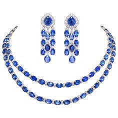 The blue sapphire and diamond necklace and earrings set features a total of 174.55 carats of oval cut and drop shape faceted Ceylon sapphires of homogeneous splendid color and crystalline texture. The design is complete with 10.90 carats of round diamonds of top quality (color, clarity and cut- F/VVS). The necklace consists of 2 necklaces nestling perfectly into each other. Each necklace displays an ideal level of flexibility, being shaped with a slight curve so as to fall perfectly around the n Blue Diamond Necklace, Sapphire Diamond Necklace, Necklace Displays, Blue Sapphire Jewelry, Necklaces Choker, Shiny Rings, Blue Sapphire Necklace, Vintage Choker, Diamond Jewelry Necklace