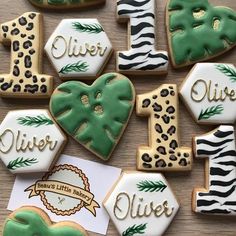 decorated cookies are arranged in the shape of letters