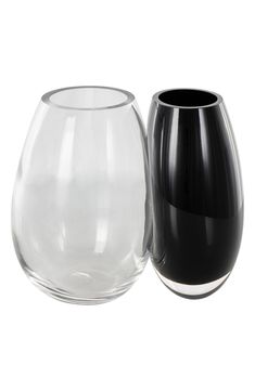 two black and white vases sitting next to each other